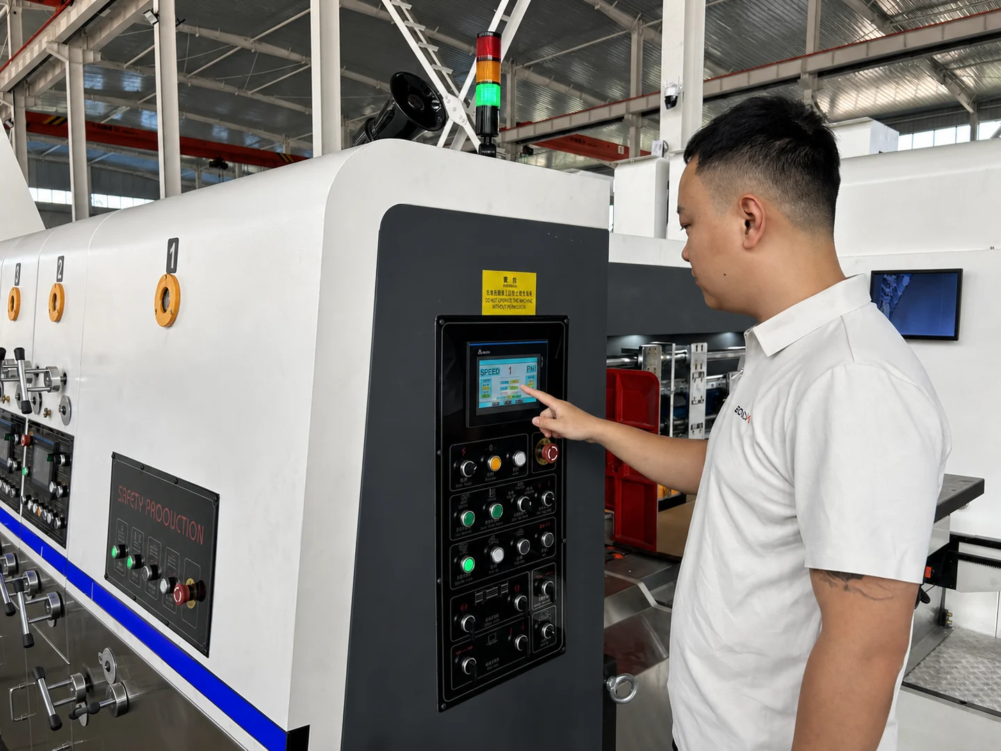 BONXI engineer inspecting carton packaging machinery in modern manufacturing factory